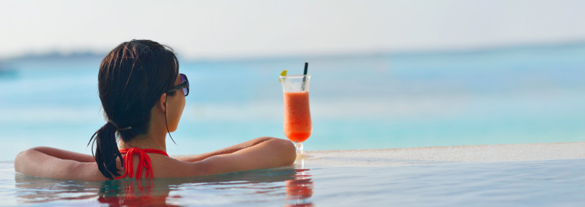 Holiday-maker relaxing in the pool